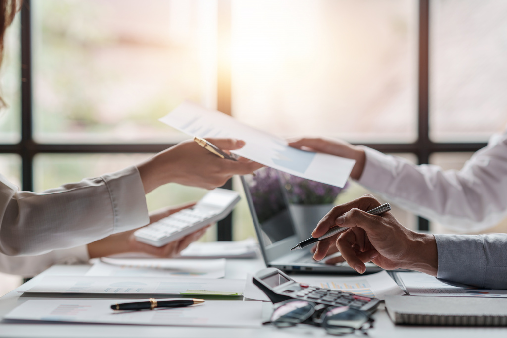 Close-up of business people meeting together to present a new pr